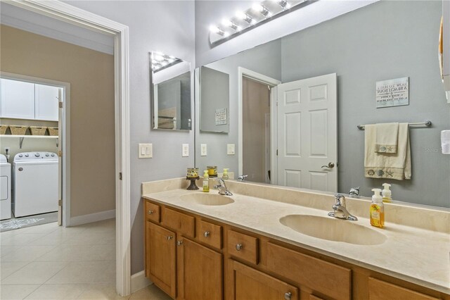 2712 Arugula Dr, North Port, FL 34289 - full bath featuring independent washer and dryer, double vanity, and tile patterned floors