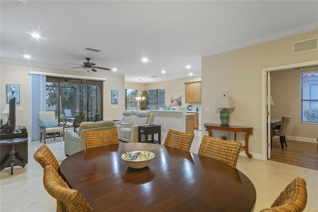 2712 Arugula Dr, North Port, FL 34289 - dining area with crown molding, plenty of natural light, light tile patterned flooring, recessed lighting, and ceiling fan