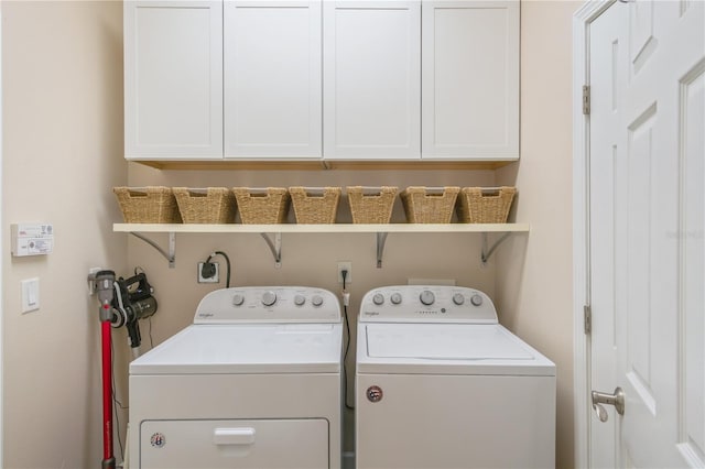 2712 Arugula Dr, North Port, FL 34289 - laundry room featuring washer and clothes dryer and cabinet space