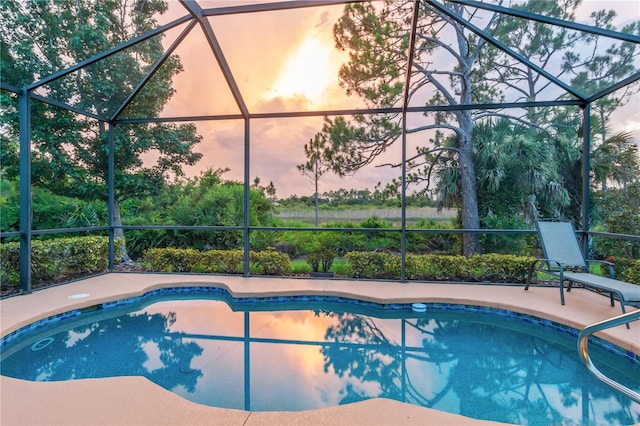 2712 Arugula Dr, North Port, FL 34289 - outdoor pool featuring glass enclosure and a patio area