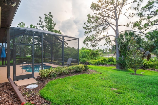 2712 Arugula Dr, North Port, FL 34289 - view of grassy yard with an outdoor pool and a patio