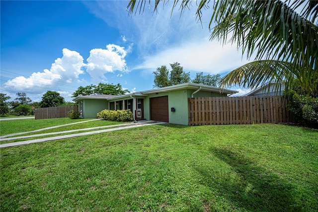 21539 Gladis Ave, Port Charlotte, FL 33952 - view of front of home with an attached garage, stucco siding, and concrete driveway