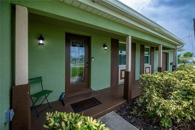 21539 Gladis Ave, Port Charlotte, FL 33952 - entrance to property featuring covered porch and stucco siding