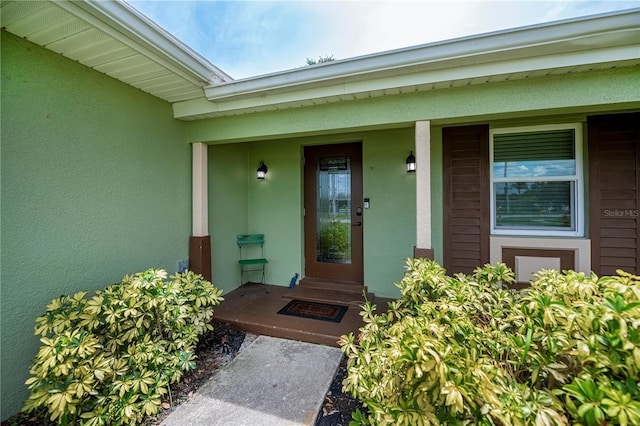 21539 Gladis Ave, Port Charlotte, FL 33952 - property entrance featuring stucco siding and covered porch