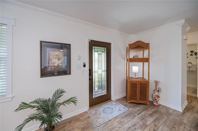 21539 Gladis Ave, Port Charlotte, FL 33952 - foyer featuring crown molding and wood finished floors