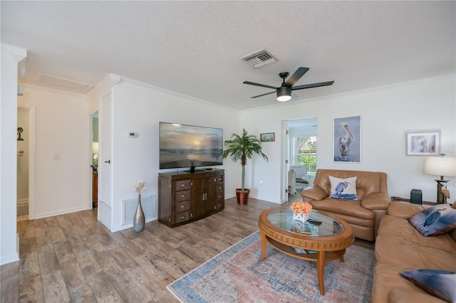 21539 Gladis Ave, Port Charlotte, FL 33952 - living area featuring ornamental molding, ceiling fan, wood finished floors, and attic access