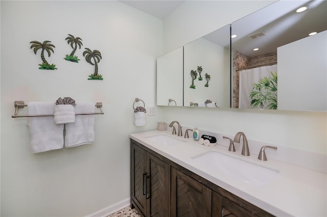 21539 Gladis Ave, Port Charlotte, FL 33952 - full bath with double vanity, recessed lighting, and a shower with shower curtain