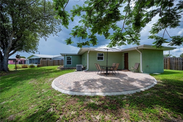 21539 Gladis Ave, Port Charlotte, FL 33952 - rear view of property with stucco siding and a patio