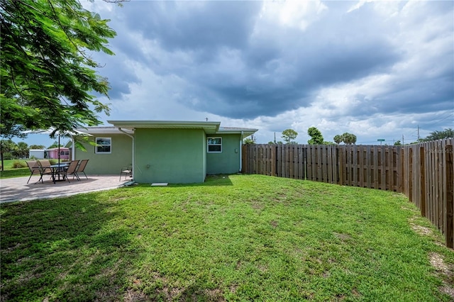 21539 Gladis Ave, Port Charlotte, FL 33952 - fenced backyard with a patio