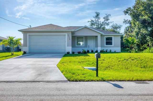 2340 Rushmore St, North Port, FL 34288 - single story home featuring driveway, stucco siding, an attached garage, and a front yard