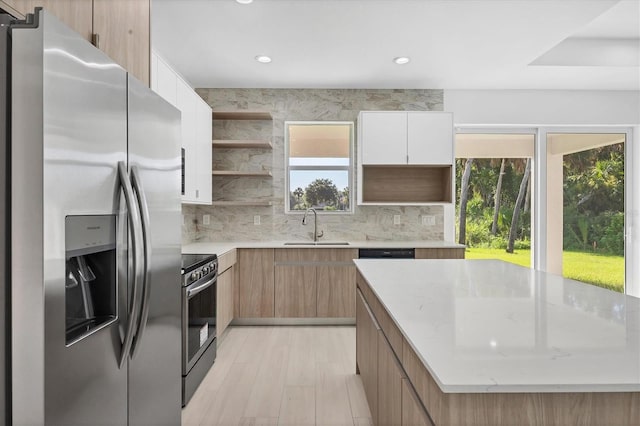 2340 Rushmore St, North Port, FL 34288 - kitchen with stainless steel appliances, open shelves, modern cabinets, decorative backsplash, and recessed lighting