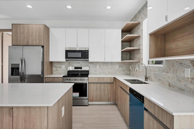 2340 Rushmore St, North Port, FL 34288 - kitchen with appliances with stainless steel finishes, open shelves, light stone countertops, decorative backsplash, and recessed lighting