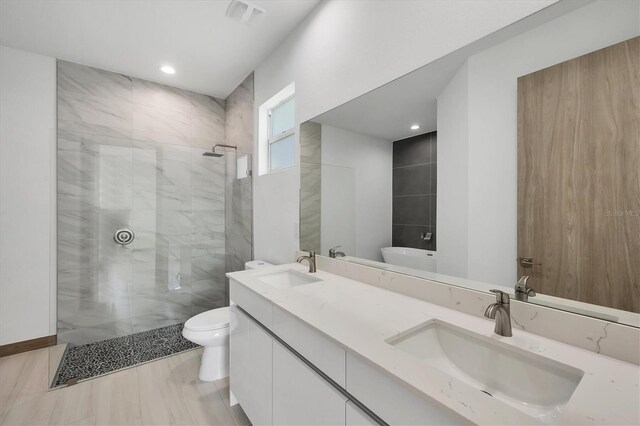 2340 Rushmore St, North Port, FL 34288 - bathroom with a marble finish shower, double vanity, and recessed lighting
