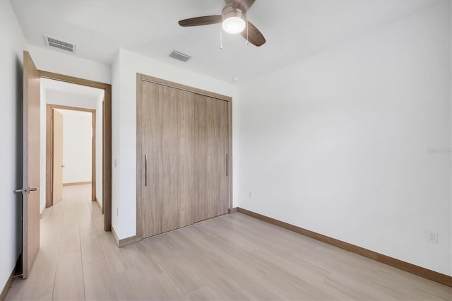 2340 Rushmore St, North Port, FL 34288 - unfurnished bedroom featuring a closet, a ceiling fan, and light wood-style floors