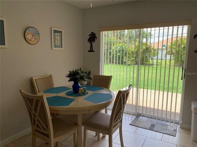 18094 Ackerman Ave, Port Charlotte, FL 33948 - dining space featuring light tile patterned floors and baseboards