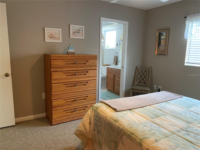 18094 Ackerman Ave, Port Charlotte, FL 33948 - bedroom with light carpet and ensuite bathroom