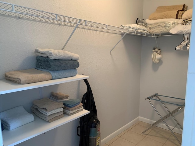 18094 Ackerman Ave, Port Charlotte, FL 33948 - walk in closet with light tile patterned floors