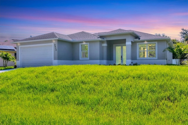 4530 Boston Ter, North Port, FL 34288 - prairie-style house featuring a garage and stucco siding