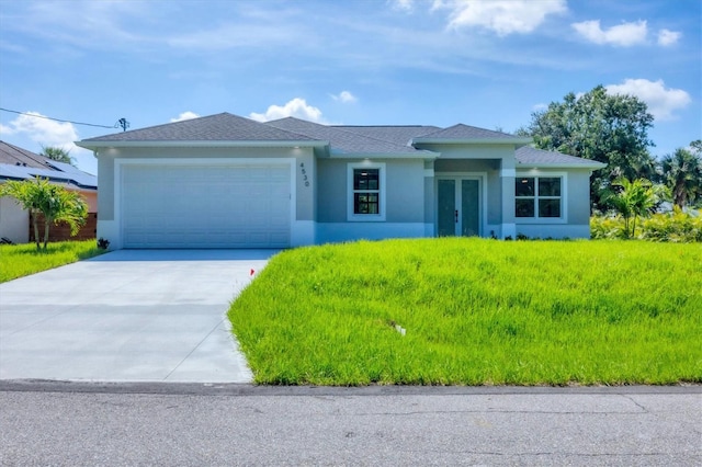 4530 Boston Ter, North Port, FL 34288 - view of front of home with french doors, stucco siding, a garage, and driveway