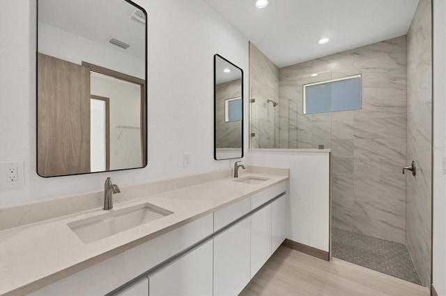 4530 Boston Ter, North Port, FL 34288 - full bath featuring walk in shower, double vanity, recessed lighting, and wood finished floors