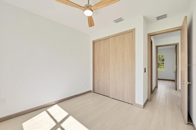 4530 Boston Ter, North Port, FL 34288 - unfurnished bedroom featuring light wood-style floors, a closet, and ceiling fan