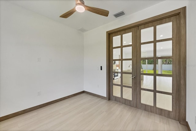 4530 Boston Ter, North Port, FL 34288 - empty room with french doors, a ceiling fan, and light wood finished floors