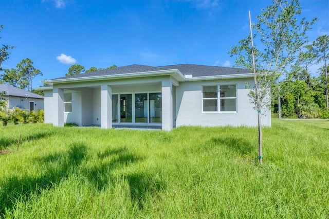 4530 Boston Ter, North Port, FL 34288 - back of house with stucco siding