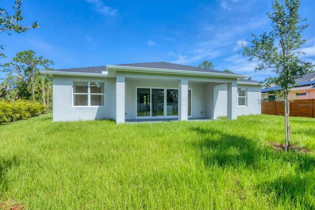 4530 Boston Ter, North Port, FL 34288 - rear view of house featuring stucco siding