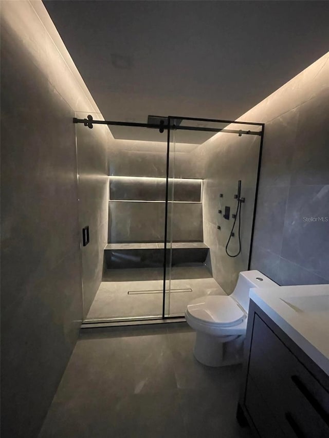 24317 Treasure Island Blvd, Punta Gorda, FL 33955 - full bathroom featuring tile walls, a stall shower, vanity, and concrete flooring