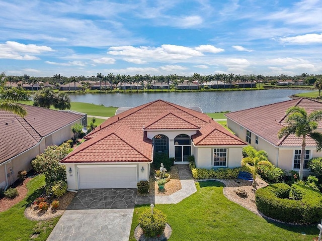 3385 Via Montana Way N, Fort Myers, FL 33917 - mediterranean / spanish house with a tile roof, a water view, a garage, stucco siding, and driveway