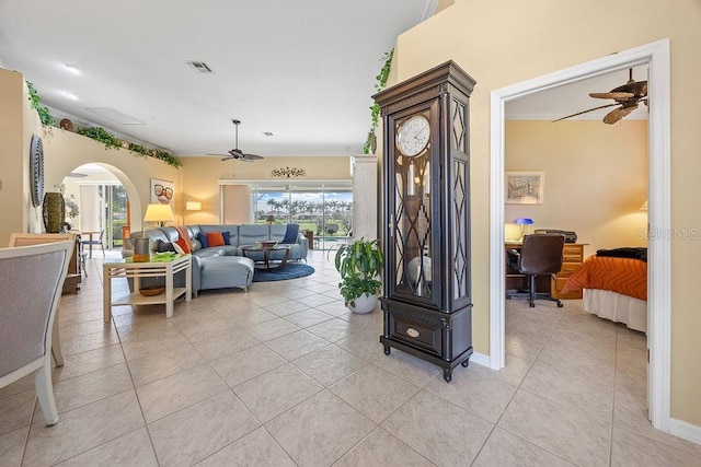 3385 Via Montana Way N, Fort Myers, FL 33917 - living area with a ceiling fan, light tile patterned floors, arched walkways, and an office area