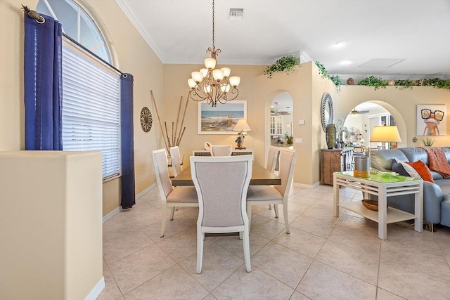 3385 Via Montana Way N, Fort Myers, FL 33917 - dining space featuring ornamental molding, arched walkways, a chandelier, and light tile patterned floors
