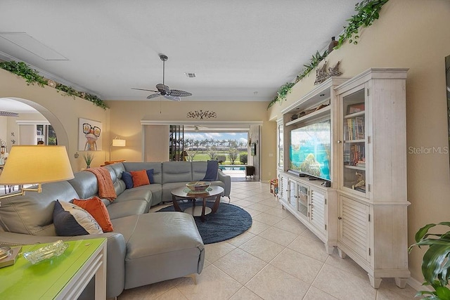 3385 Via Montana Way N, Fort Myers, FL 33917 - living room featuring a ceiling fan, light tile patterned flooring, and arched walkways