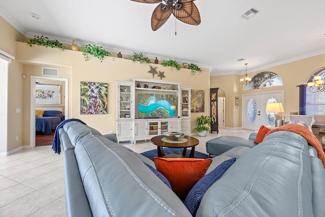 3385 Via Montana Way N, Fort Myers, FL 33917 - living room with a chandelier, a ceiling fan, light tile patterned floors, crown molding, and arched walkways