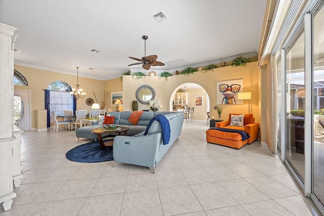 3385 Via Montana Way N, Fort Myers, FL 33917 - living room featuring a ceiling fan, crown molding, arched walkways, light tile patterned floors, and a chandelier