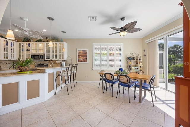 3385 Via Montana Way N, Fort Myers, FL 33917 - dining area featuring a ceiling fan, ornamental molding, plenty of natural light, light tile patterned floors, and recessed lighting