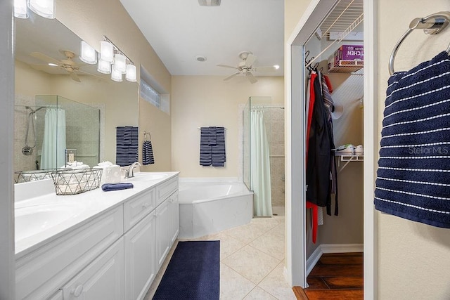 3385 Via Montana Way N, Fort Myers, FL 33917 - bathroom with ceiling fan, a shower stall, a garden tub, and double vanity