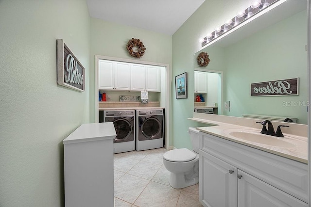 3385 Via Montana Way N, Fort Myers, FL 33917 - washroom featuring washing machine and clothes dryer, cabinet space, and light tile patterned floors