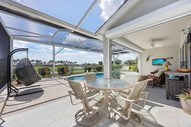 3385 Via Montana Way N, Fort Myers, FL 33917 - view of patio / terrace featuring a ceiling fan, outdoor dining space, glass enclosure, and an outdoor pool
