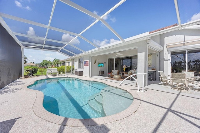 3385 Via Montana Way N, Fort Myers, FL 33917 - swimming pool with a patio area, glass enclosure, and a ceiling fan