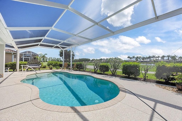 3385 Via Montana Way N, Fort Myers, FL 33917 - swimming pool featuring a patio and glass enclosure