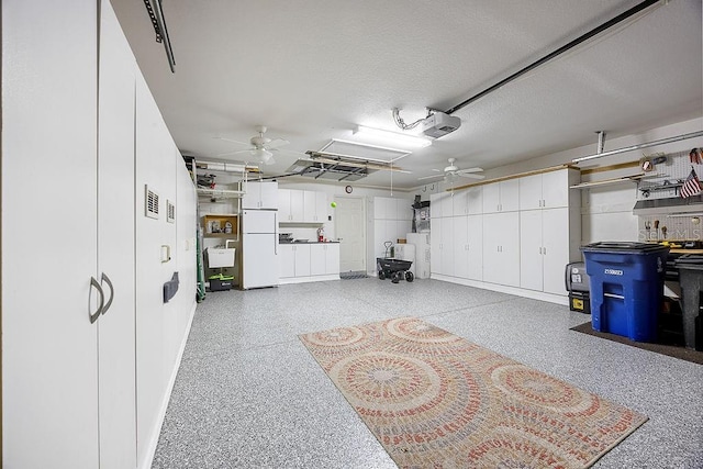 3385 Via Montana Way N, Fort Myers, FL 33917 - garage featuring freestanding refrigerator, a ceiling fan, and a garage door opener