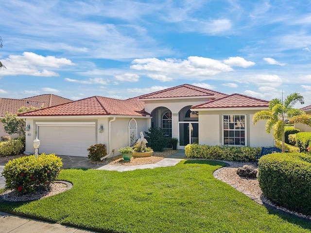 3385 Via Montana Way N, Fort Myers, FL 33917 - mediterranean / spanish-style house with stucco siding, a tiled roof, and a front yard