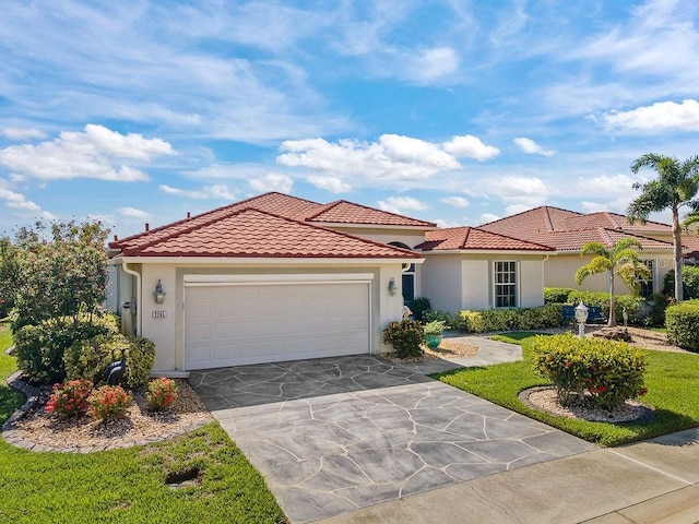 3385 Via Montana Way N, Fort Myers, FL 33917 - mediterranean / spanish home with an attached garage, stucco siding, a tiled roof, and concrete driveway