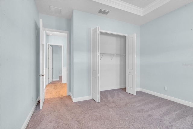10478 Coquina Ct, Placida, FL 33946 - unfurnished bedroom with carpet floors, crown molding, and a closet