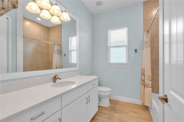 10478 Coquina Ct, Placida, FL 33946 - full bath featuring vanity, shower / tub combo, wood finished floors, and a chandelier