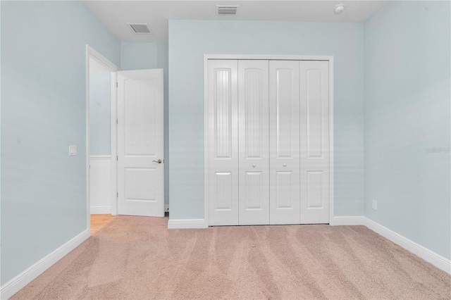 10478 Coquina Ct, Placida, FL 33946 - unfurnished bedroom featuring carpet flooring and a closet