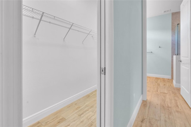 10478 Coquina Ct, Placida, FL 33946 - spacious closet featuring light wood finished floors