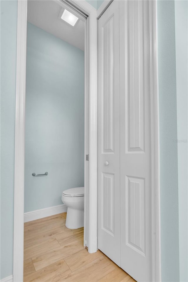 10478 Coquina Ct, Placida, FL 33946 - bathroom with wood finished floors and a closet