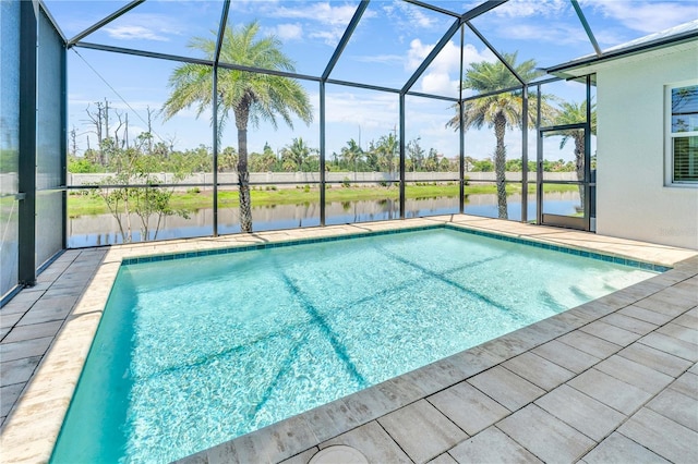 10478 Coquina Ct, Placida, FL 33946 - outdoor pool with a water view, a patio area, and glass enclosure